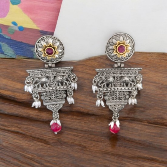 silver earrings with dangling red stones