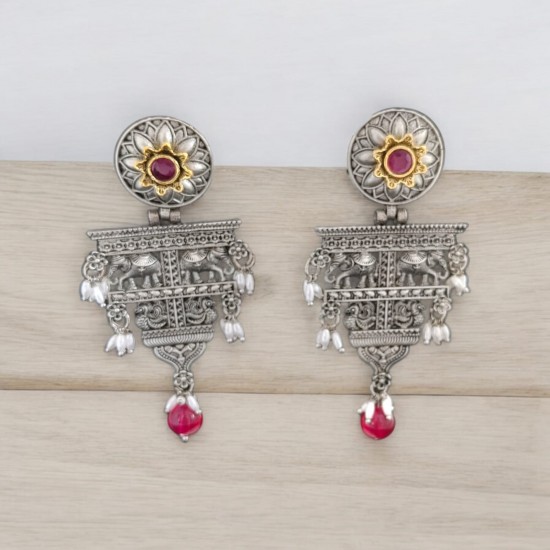 silver earrings with dangling red stones