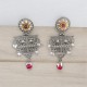 silver earrings with dangling red stones