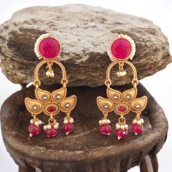 golden earrings with dangling beads